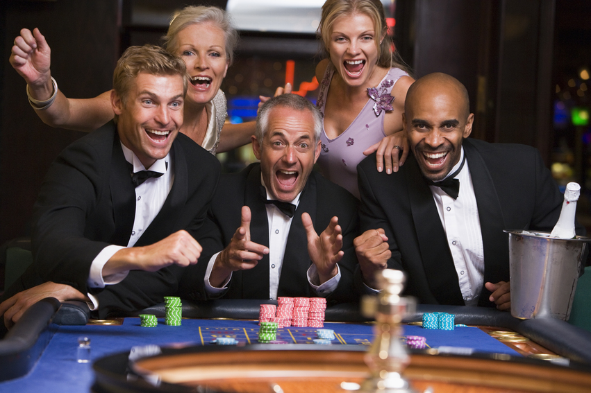 Group of friends celebrating at roulette table